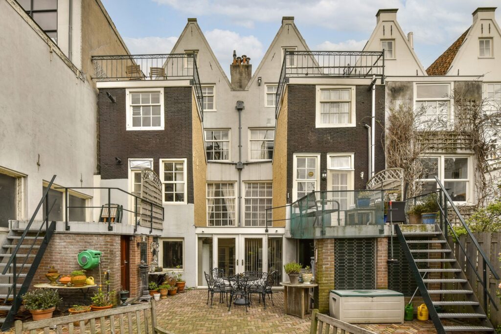 Period townhouses around a paved courtyard