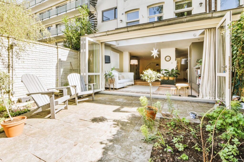 Open-plan living space with doors opening onto a patio
