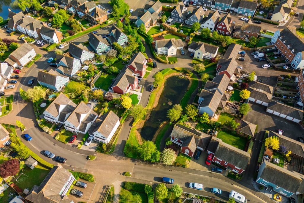 Aerial view of a residential neighbourhood with gardens and trees